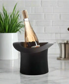 Wine bottle in a black ice bucket on a white background