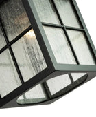 Decorative light fixture with glass panels on a white background