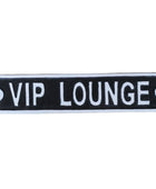 A rectangular black and white sign reading 'VIP LOUNGE' mounted against a light brown wooden plank background.
