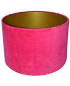 Pink velvet lampshade with gold interior on a white background