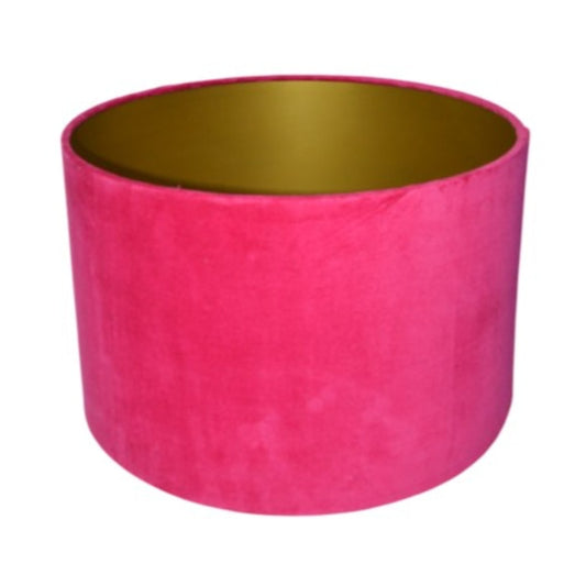 Pink velvet lampshade with gold interior on a white background