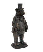 Statue of a bear in formal attire with a top hat on a white background