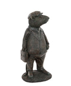 Statue of a bear in a suit and hat holding a briefcase on a white background