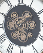 Close-up of a clock face with mechanical gears and Roman numerals