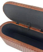 Brown leather case with a black interior on a white background