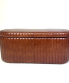 Brown leather ottoman on a white background
