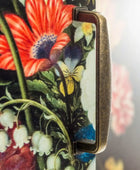 Phone case with floral design featuring red, yellow, and white flowers.