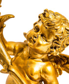 Gold cherub figurine with a white background
