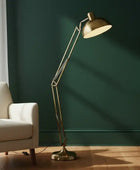 Gold floor lamp on a white background