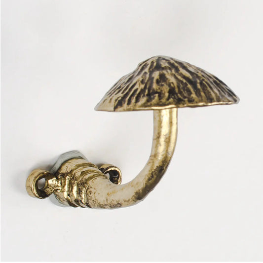A mushroom-shaped wall hook with a textured metallic finish, featuring a curved stem and a flat cap, shown against a plain white background.