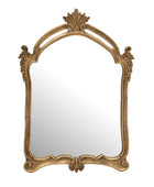 An ornate arched wall mirror with a decorative gold-finished frame featuring sculpted leaf and scroll motifs, shown against a plain white background.