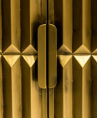 Close-up of a gold metallic surface with geometric patterns