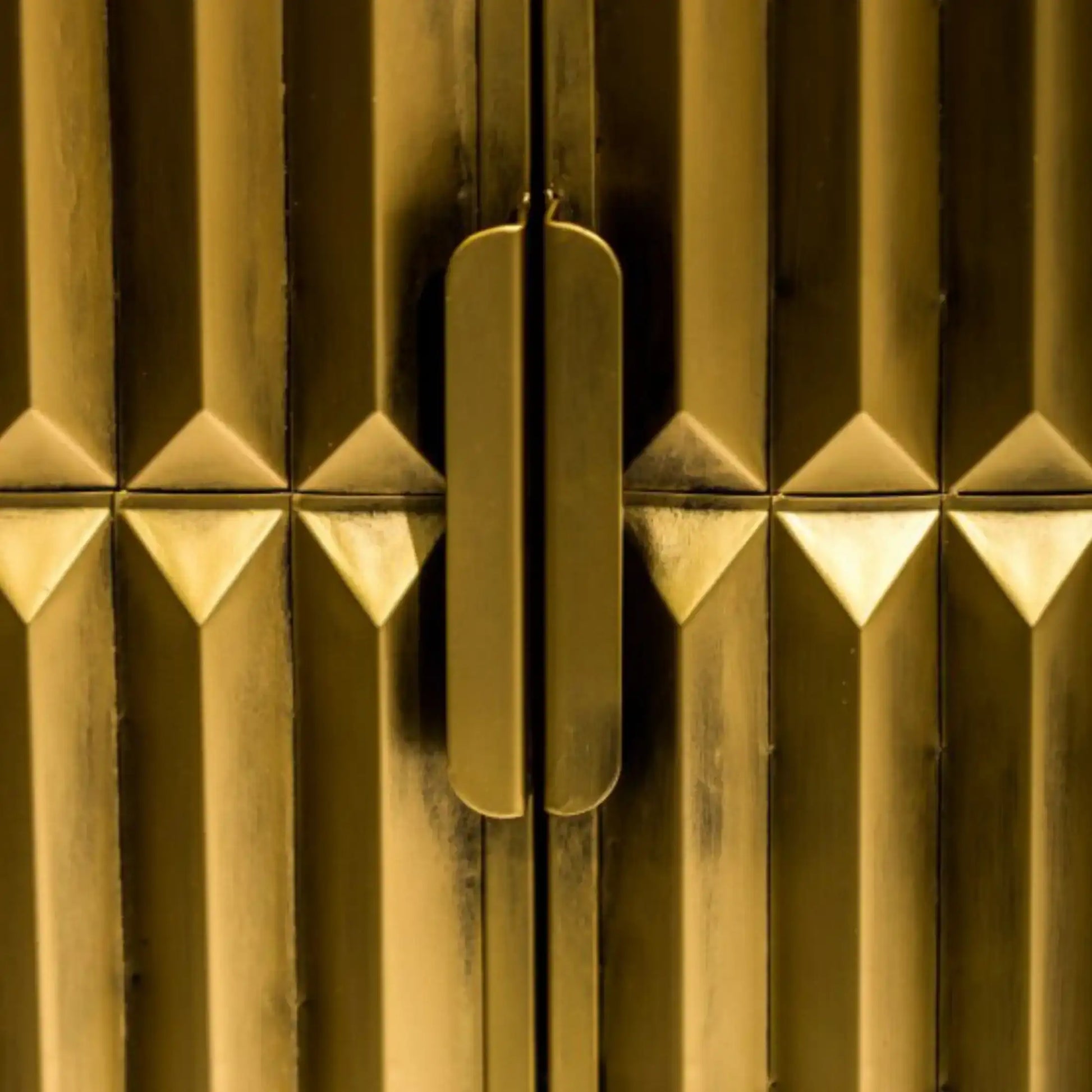 Close-up of a gold metallic surface with geometric patterns