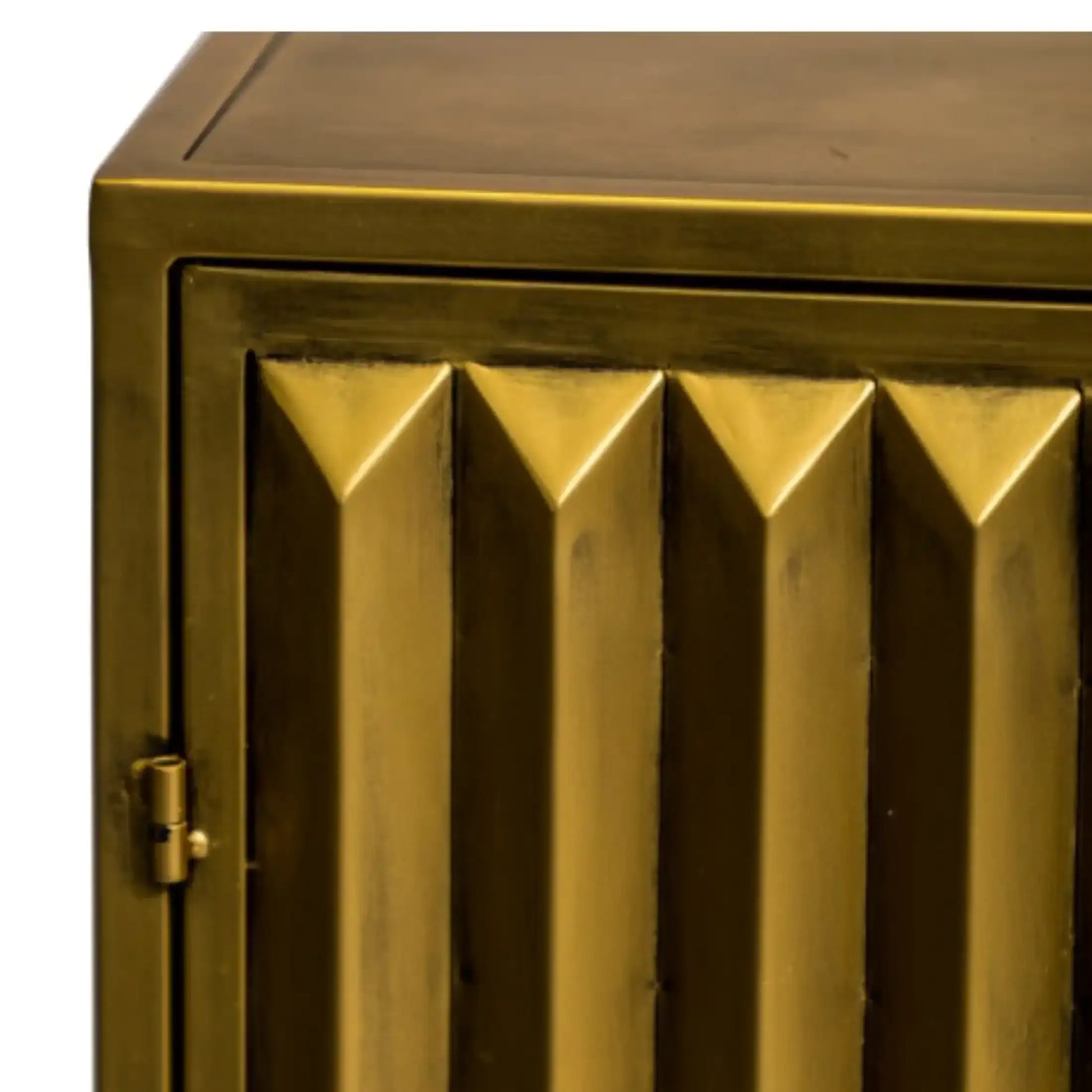 Gold metallic cabinet with geometric design on a white background