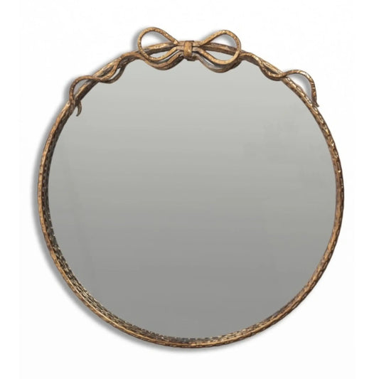 Round mirror with decorative brown frame on a white background
