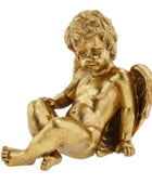 Gold statue of a cherub on a white background