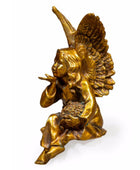 Bronze statue of an angel holding a cornucopia on a white background