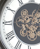 Close-up of a clock with visible gears and Roman numerals