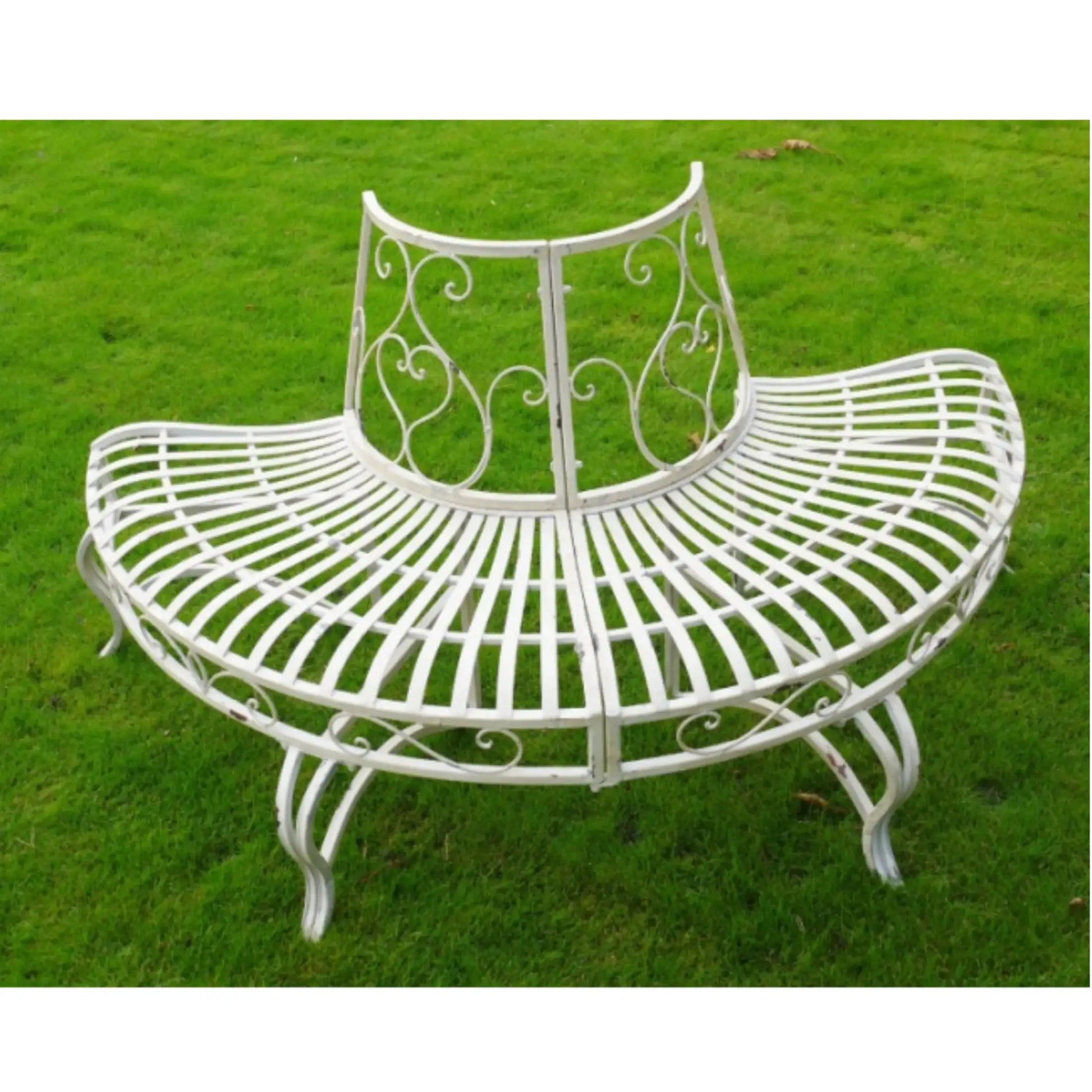 White metal bench with decorative backrest on a grassy background