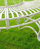 White metal bench on a grassy background