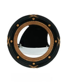 Round mirror with black frame and gold decorative elements on a white background