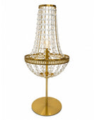 A gold-finished table lamp with a tiered crystal chandelier shade and a round crystal bowl on a matching circular base, shown against a plain white background.
