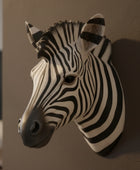 Zebra head sculpture on a wall