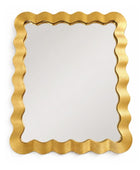 Gold-framed mirror with wavy edge on a white background
