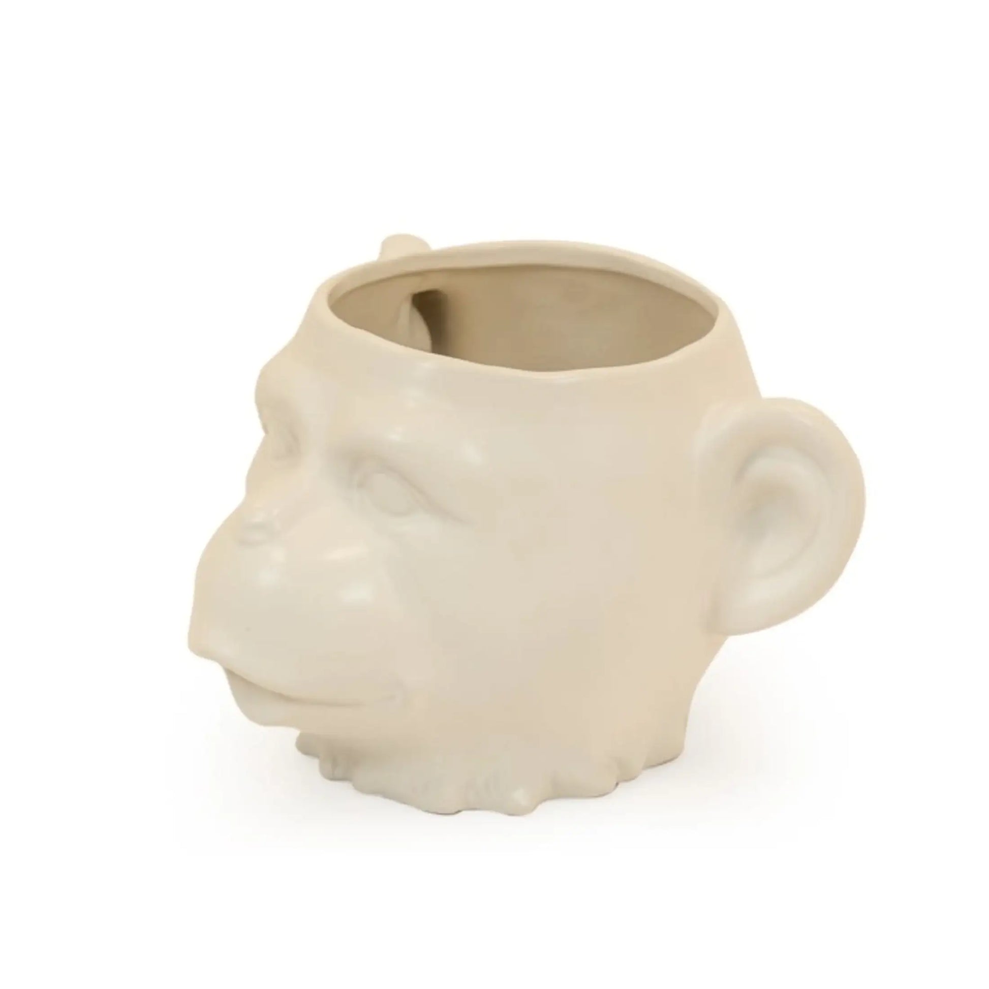 Ceramic mug shaped like a monkey's head on a white background