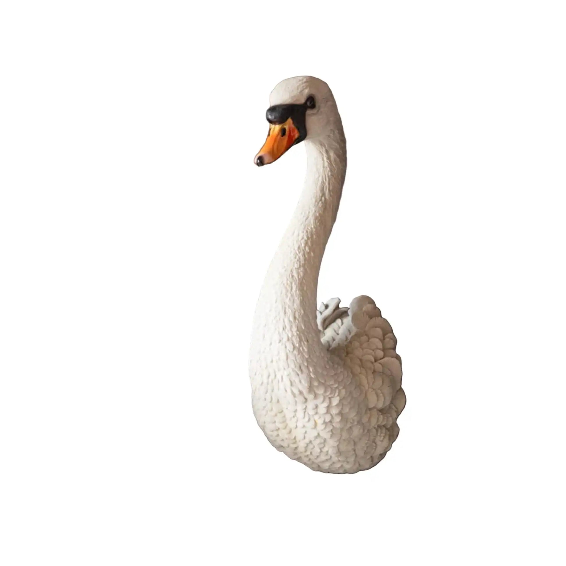 White swan figurine on a white background