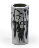 Cylindrical vase with black umbrella and cane design on a white background