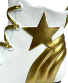 White shoe with gold star and laces on a white background