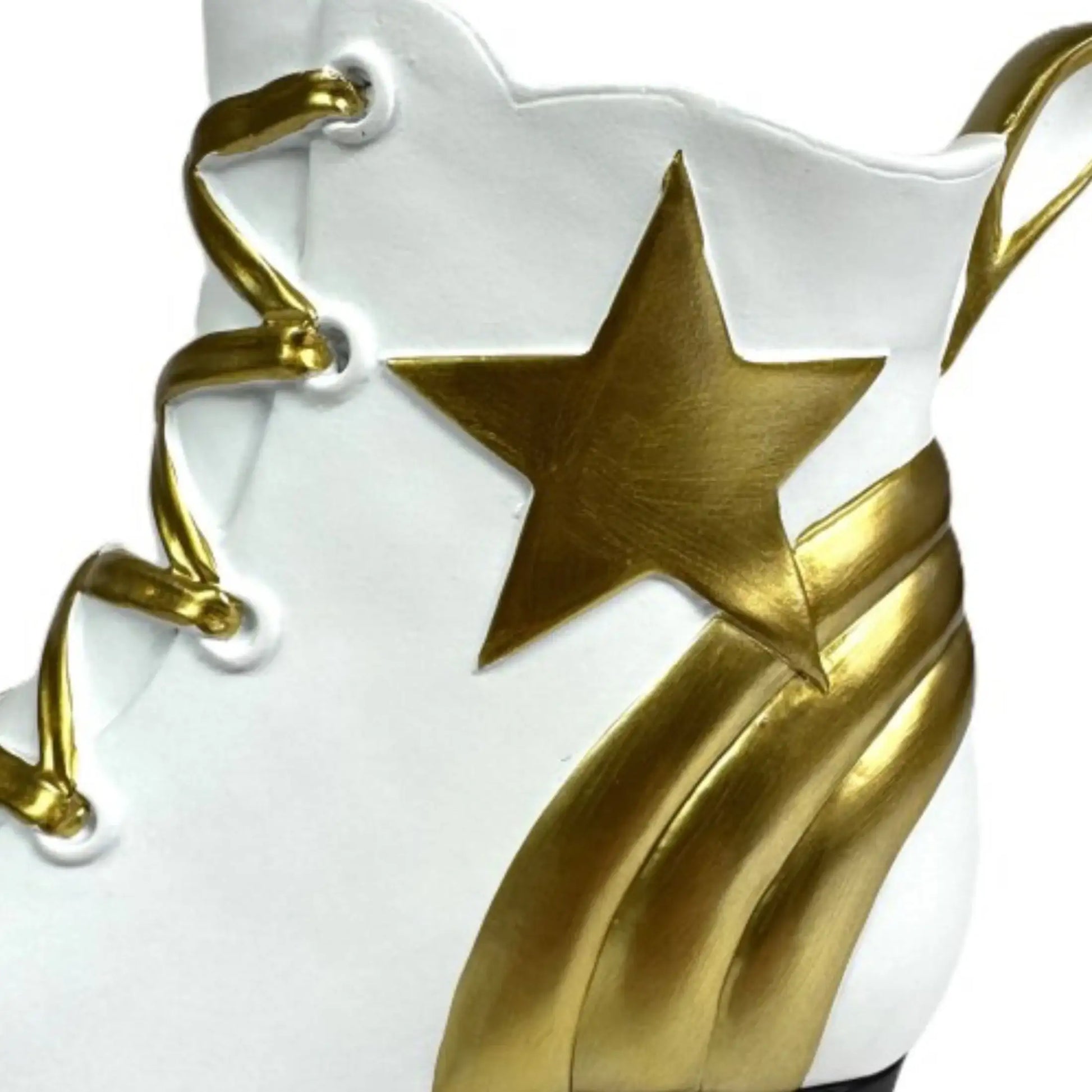 White shoe with gold star and laces on a white background
