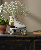 Decorative roller skate with a plant and book on a wooden surface