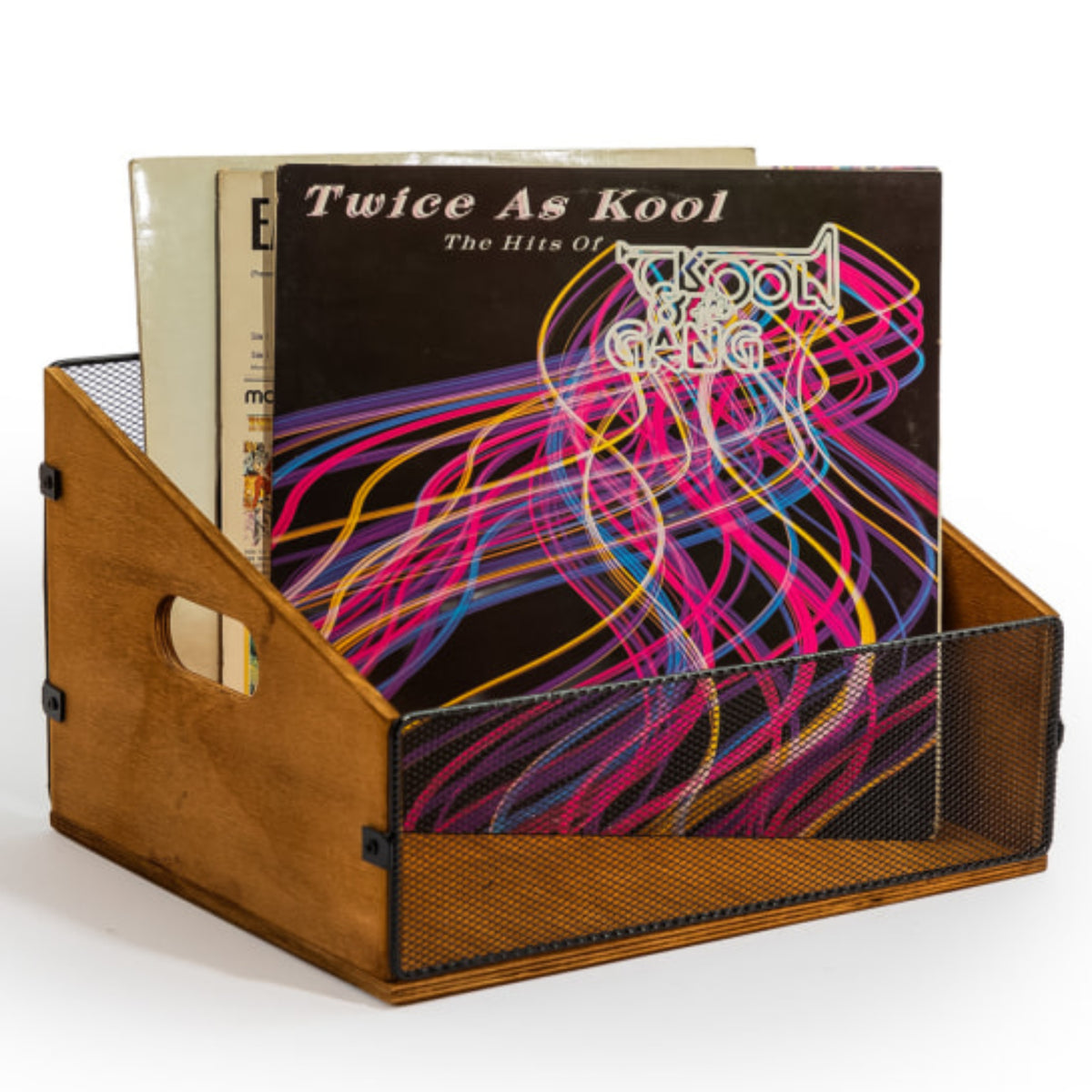 A wooden record holder with a black mesh front, holding several vinyl records, including the album 'Twice As Kool' by The Kool & Gang.