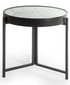 Round side table with glass top and black metal frame on a white background