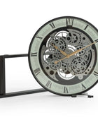 Mechanical clock with visible gears on a white background
