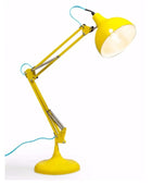 Yellow desk lamp with a long arm on a white background