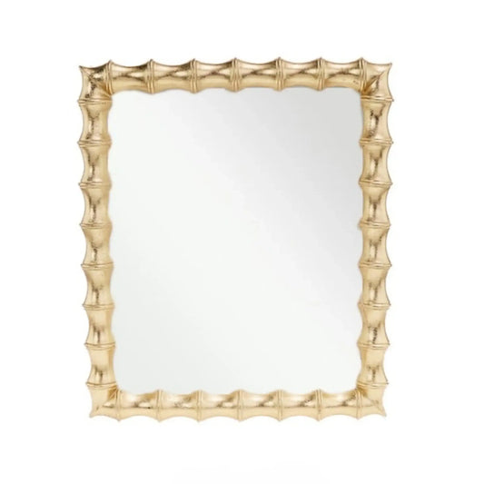 Gold-framed mirror with a textured design on a white background