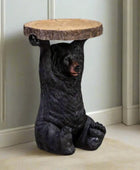 Bear-shaped side table with wooden top on a neutral background