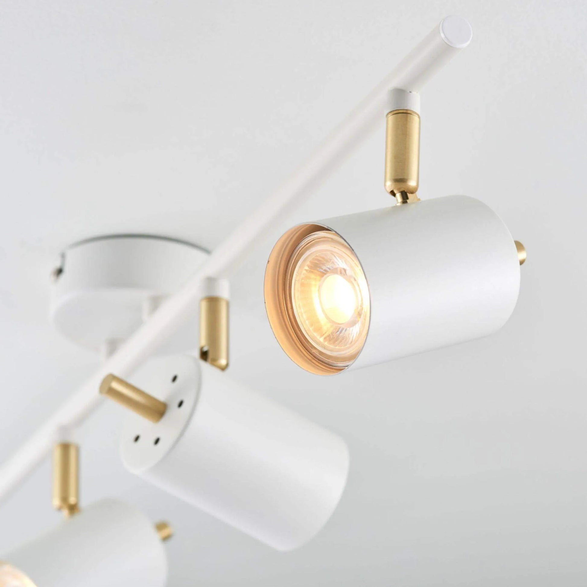 Brushed Brass and Matt White 4 Gang Spot Lamp - The Farthing