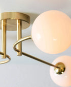 Brushed Brass Art Deco Inspired Four Globe Ceiling Light - The Farthing