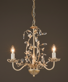 Decorative chandelier with two lit lights on a dark background