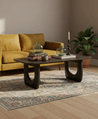 Modern coffee table with decorative items on a white background