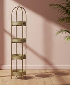Tall, decorative metal shelf with three tiers against a pink wall.