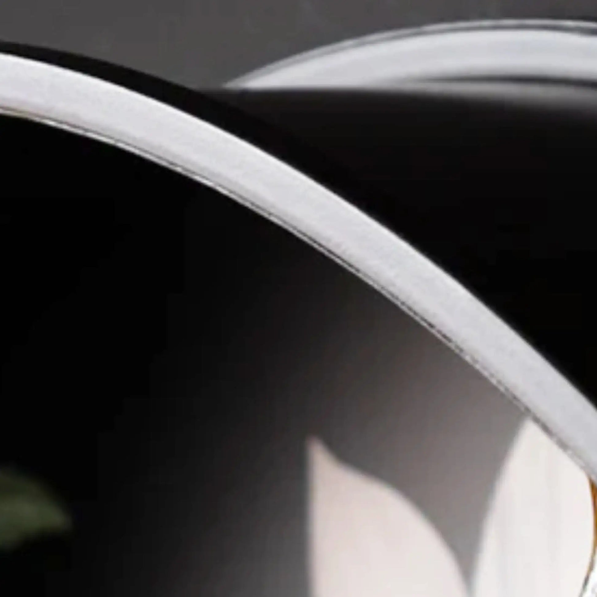 Close-up of a car's headlight with a blurred background