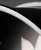Close-up of a car's headlight with a blurred background