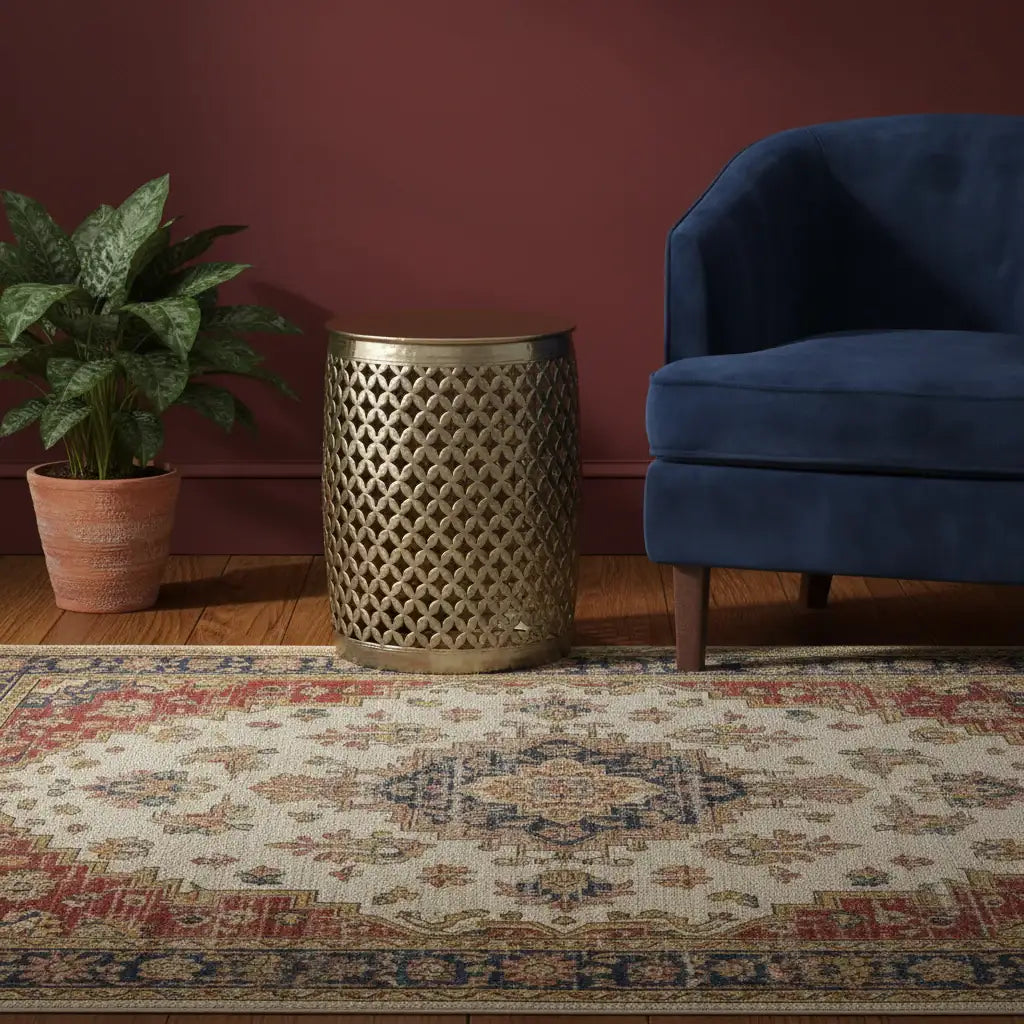 Decorative rug with a blue chair and patterned side table against a red wall.