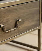 Wooden drawer with metal handle on a blurred background