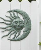 Decorative wall art of a sun and moon with faces on a white wooden background